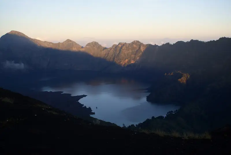 Segara Anak lake in the caldera at dusk, seen from the Plawangan II campsite